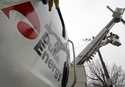 Duke Energy employees work on power lines in Charlotte, N