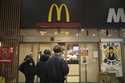 People stands outside a McDonald's store in Tokyo, March 15, 2024. (AP Photo/Hiro Komae, File)
