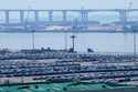 Cranes and shipping containers are seen at a port in Busan, South Korea, Thursday, July 31, 2025